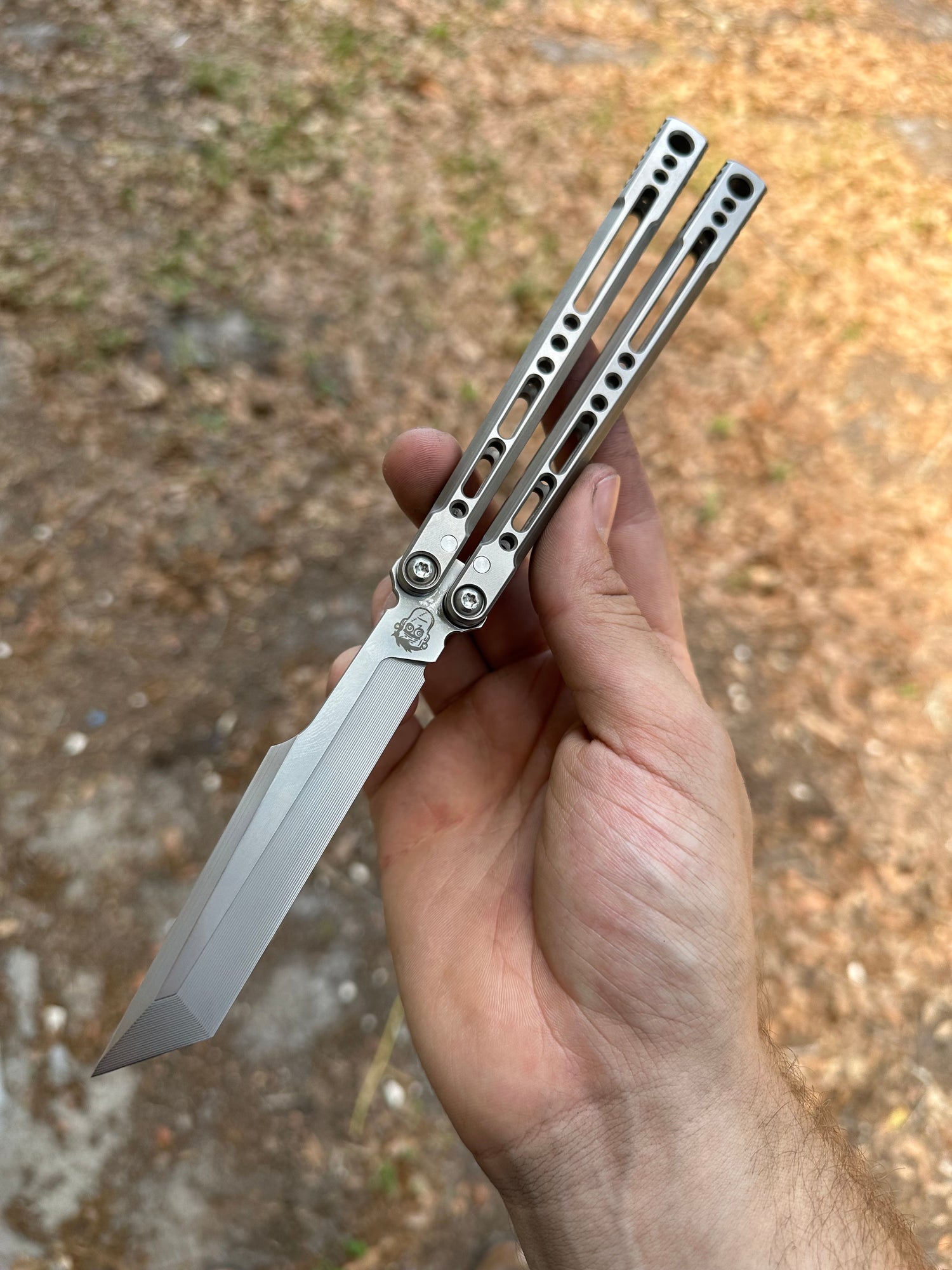 Static balisong with channel titanium handles and S35VN blade