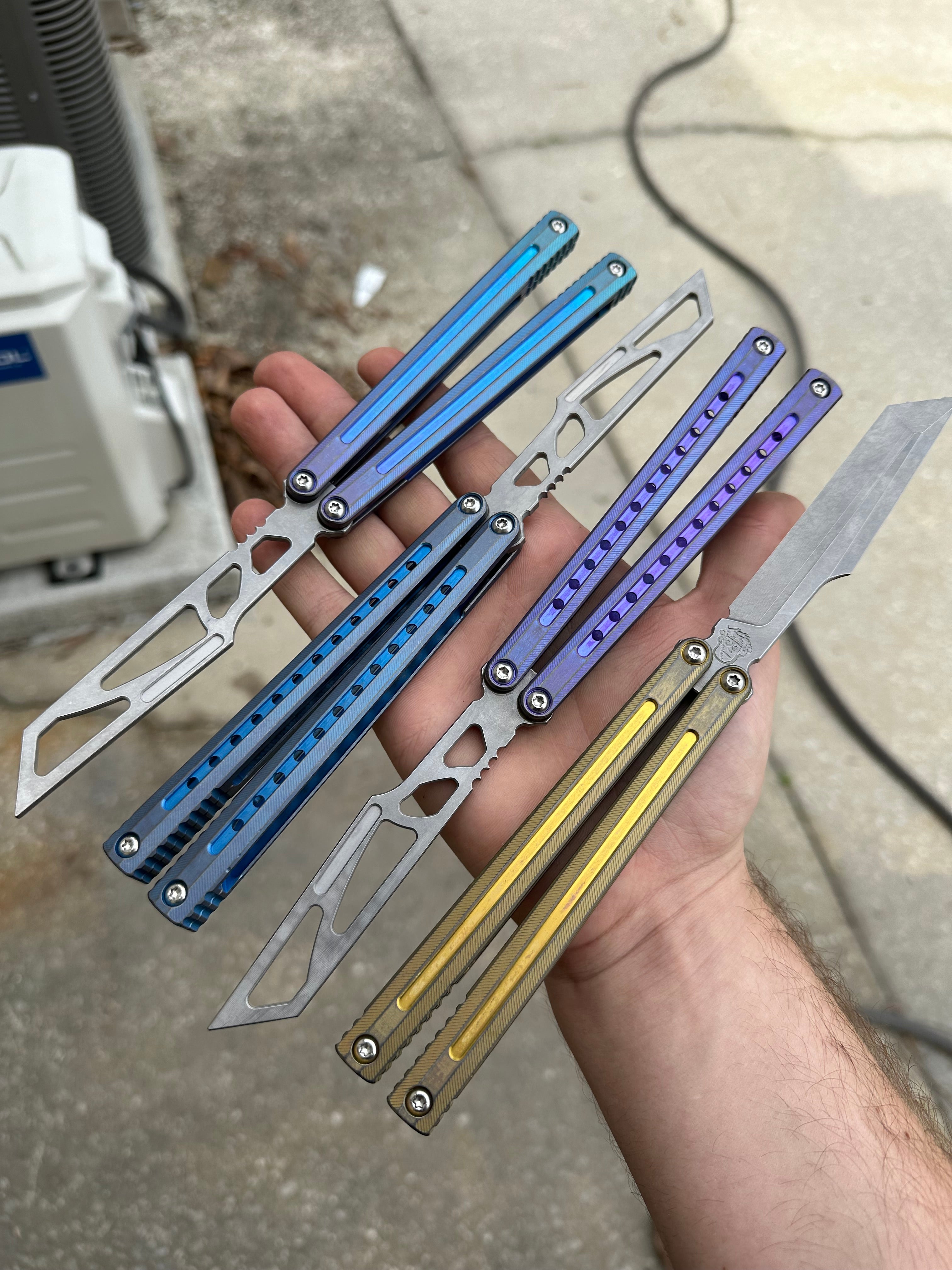 Ion balisong with titanium handles and customizable weight system